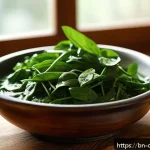 식재료 전부를 활용하는 고급 요리법 - A vibrant kitchen scene showcasing a rustic wooden table filled with fresh leafy greens like spinach...