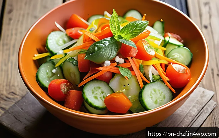 여름철 식재료 활용 요리 레시피 - A vibrant summer mixed vegetable salad bowl featuring fresh cucumber, ripe tomatoes, colorful capsic...